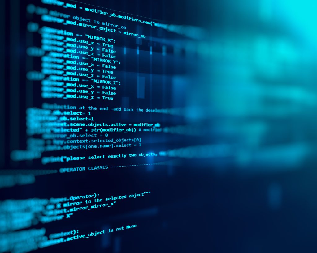 Technology background of programming code on a computer screen.